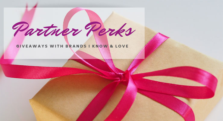 A gift box wrapped in brown paper and a pink ribbon tied neatly on top with the header reading Partner Perks - Giveaways from brands I know and love